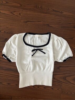 White Short-Sleeve Knit Top with Black Trim and Bow